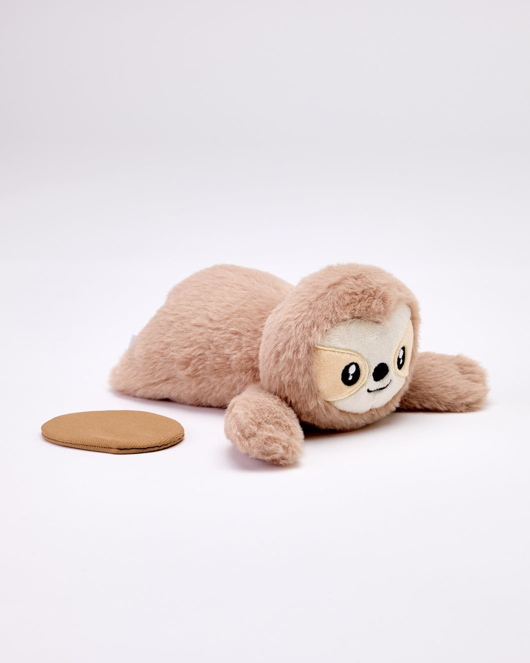 Plush sloth toy on a white background